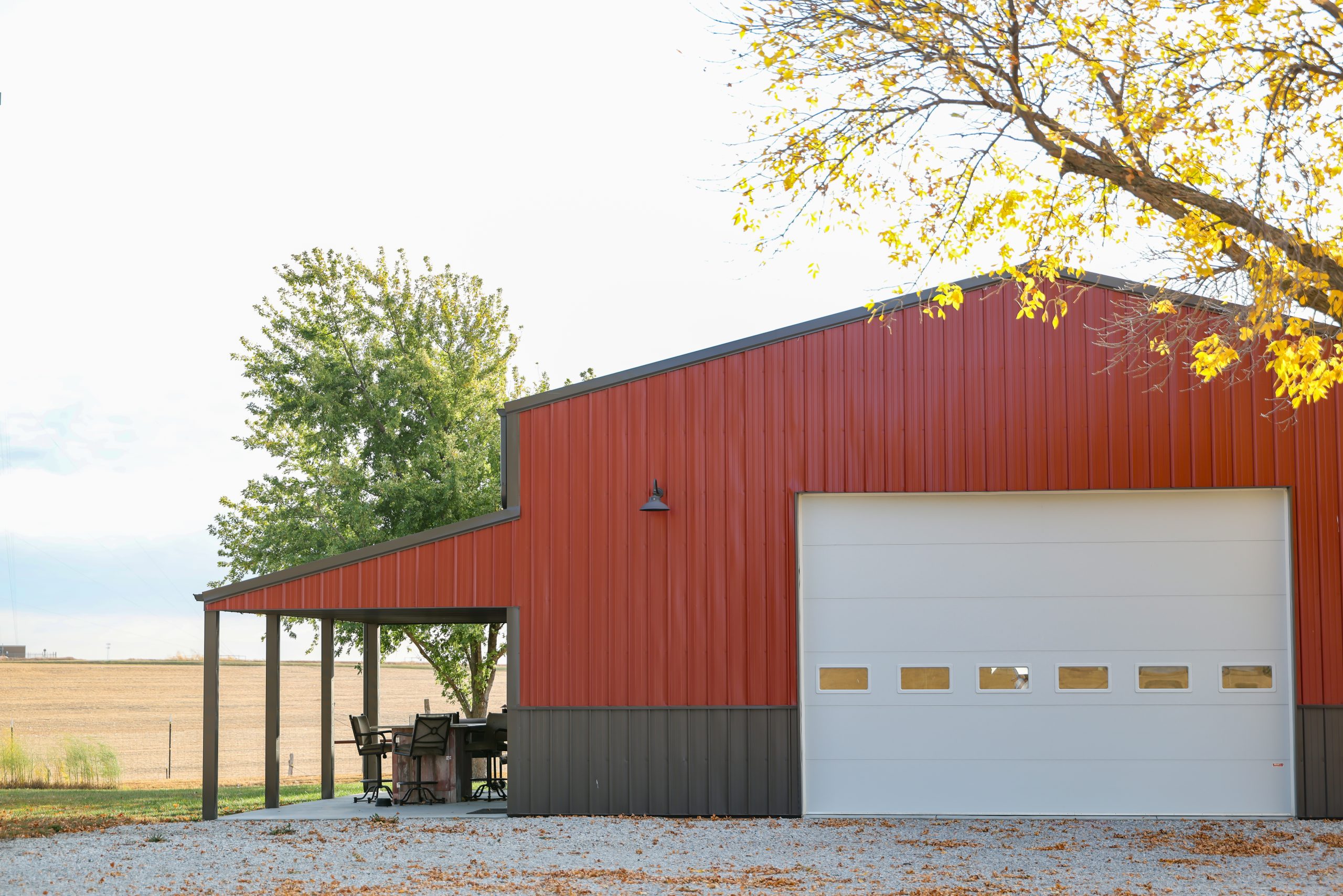 A shop with red and black metal siding